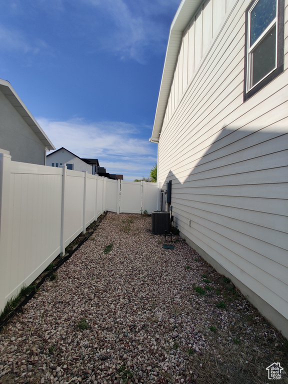 Fenced backyard with central air condition unit