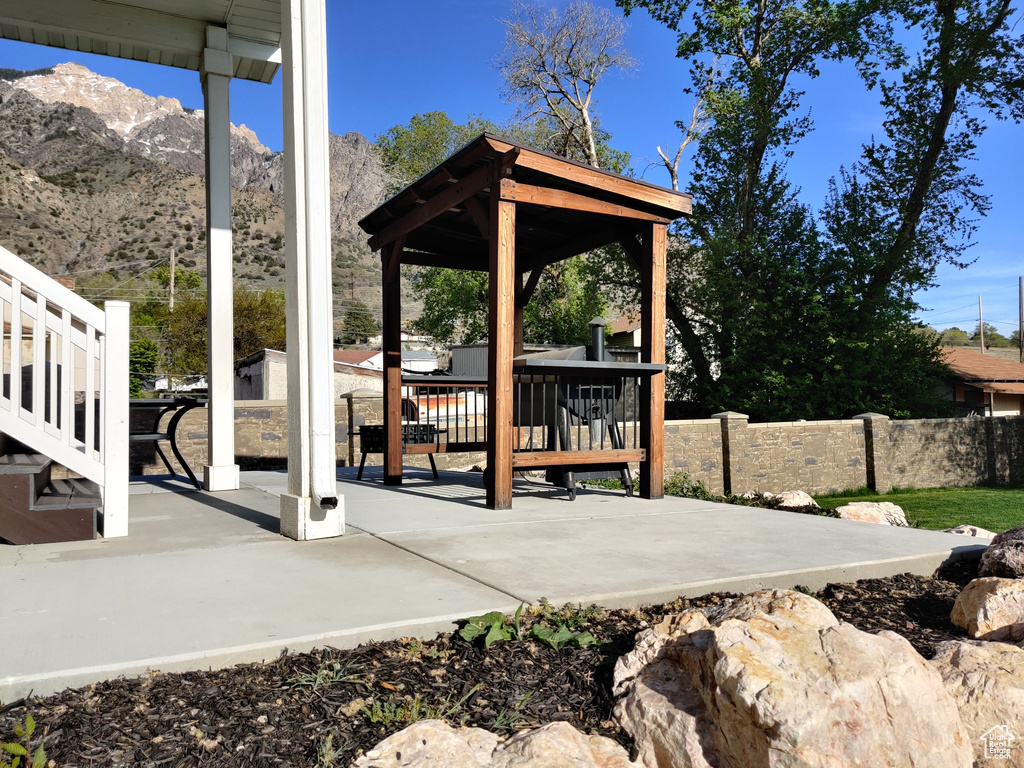 View of patio / terrace featuring a gazebo and a mountain view