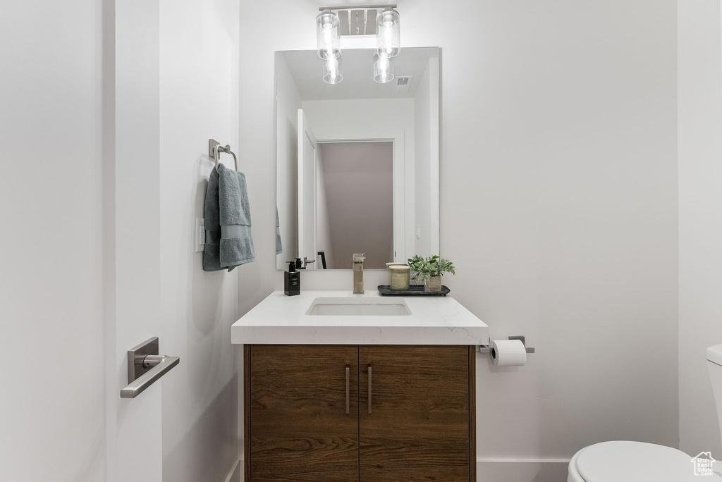 Bathroom with vanity and toilet