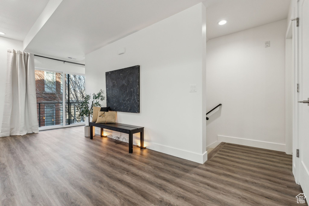 Living room with dark wood-type flooring