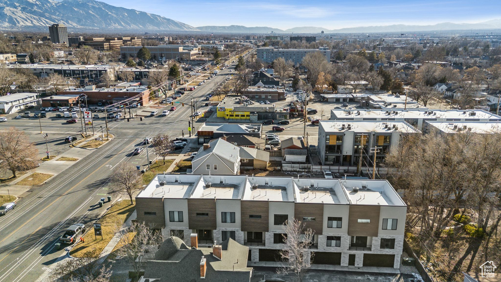 Birds eye view of property with a mountain view