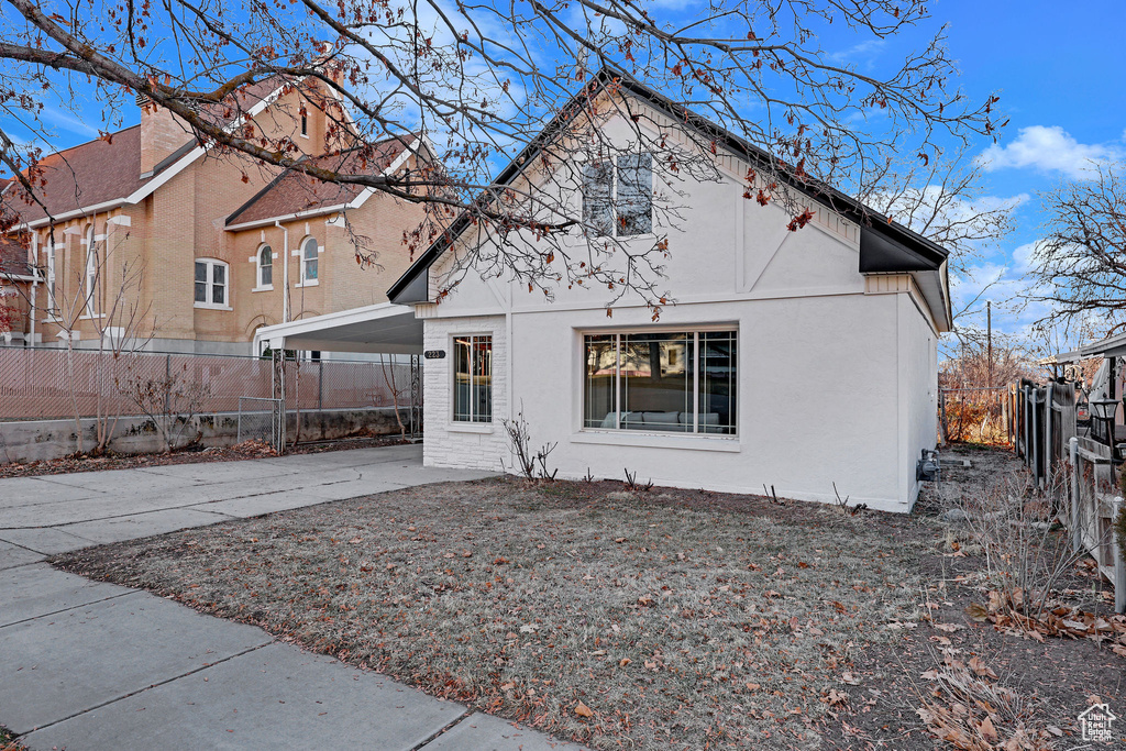 Exterior space featuring a carport