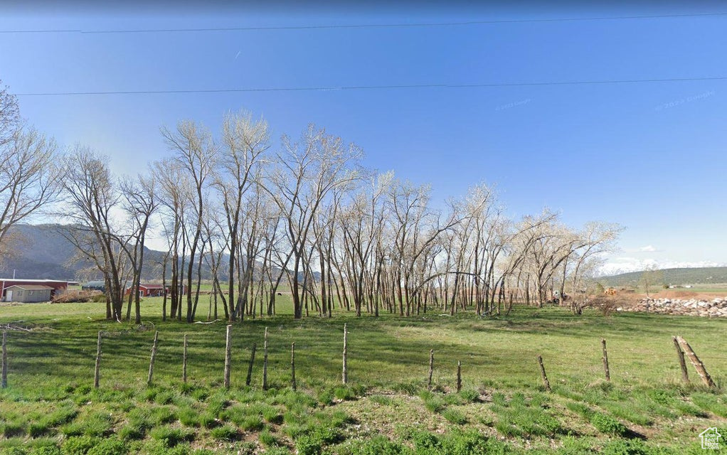 View of yard featuring a mountain view and a rural view