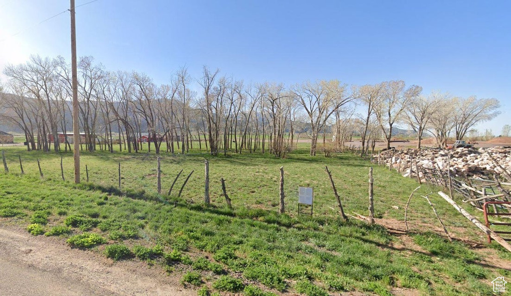 View of yard with a rural view