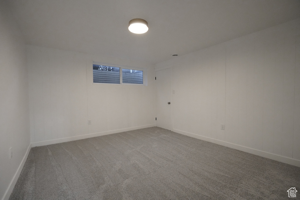 Empty room with carpet floors