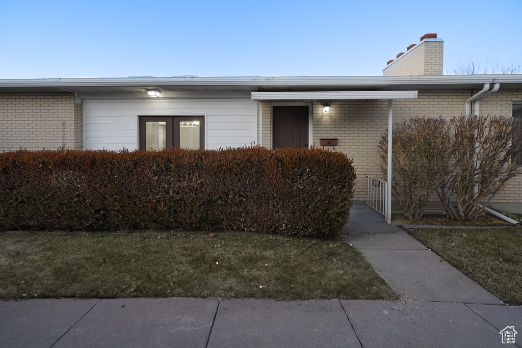 Property entrance with a lawn