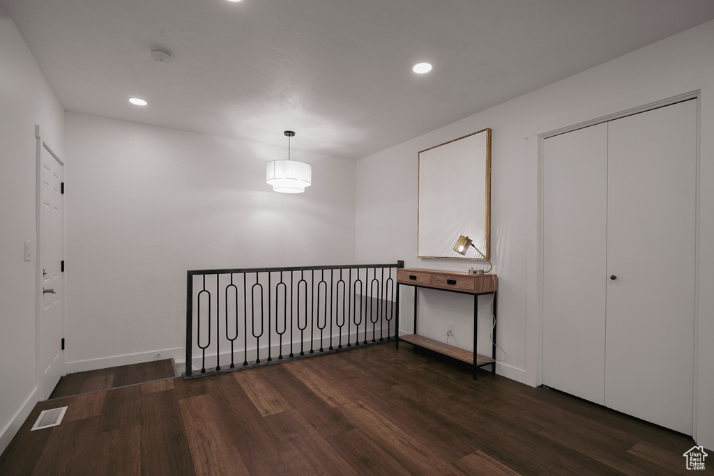 Interior space featuring dark wood-type flooring