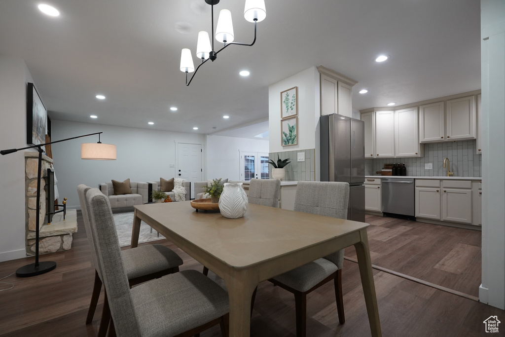 Dining room featuring dark wood-type flooring and sink