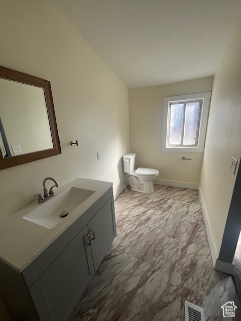 Bathroom featuring toilet and vanity