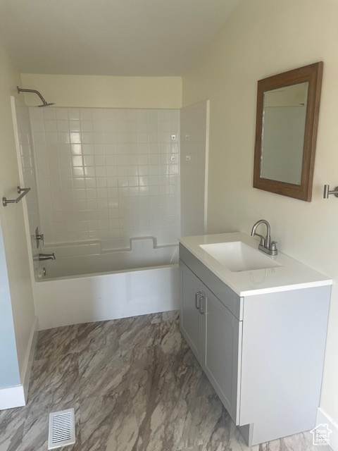 Bathroom featuring vanity and bathing tub / shower combination