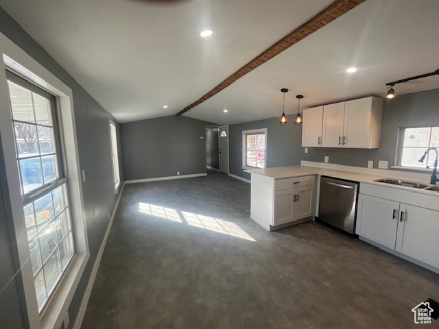 Kitchen featuring white cabinets, dishwasher, sink, kitchen peninsula, and lofted ceiling with beams