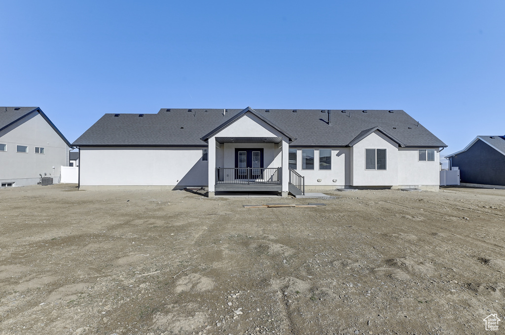 View of front of property featuring central AC unit