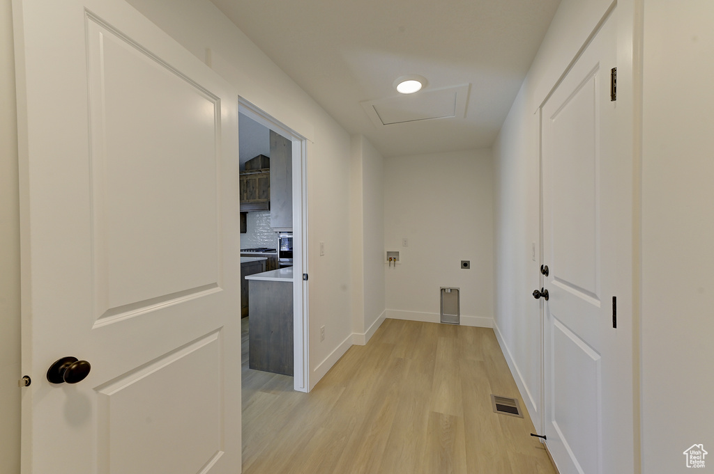 Corridor featuring light hardwood / wood-style floors