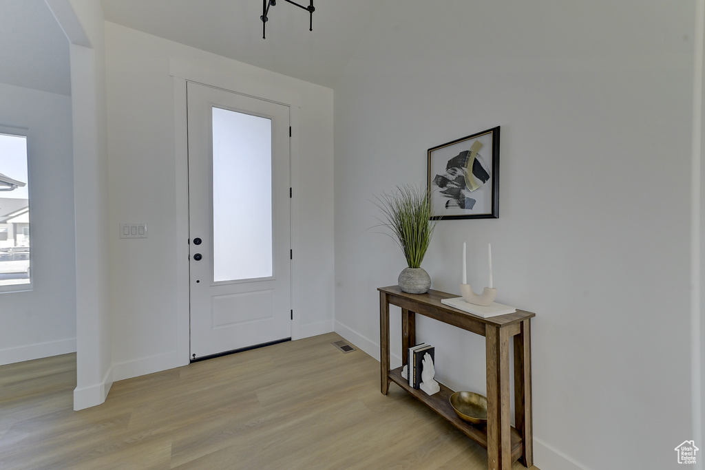 Foyer entrance featuring light hardwood / wood-style flooring and plenty of natural light