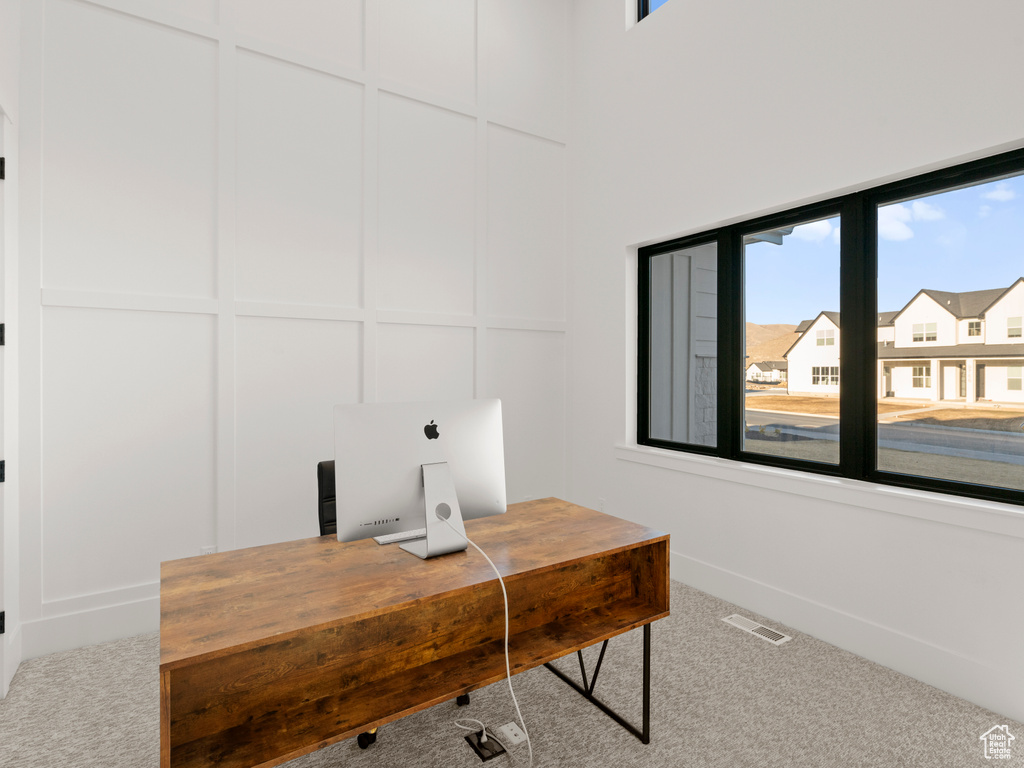 Home office featuring carpet and a wealth of natural light