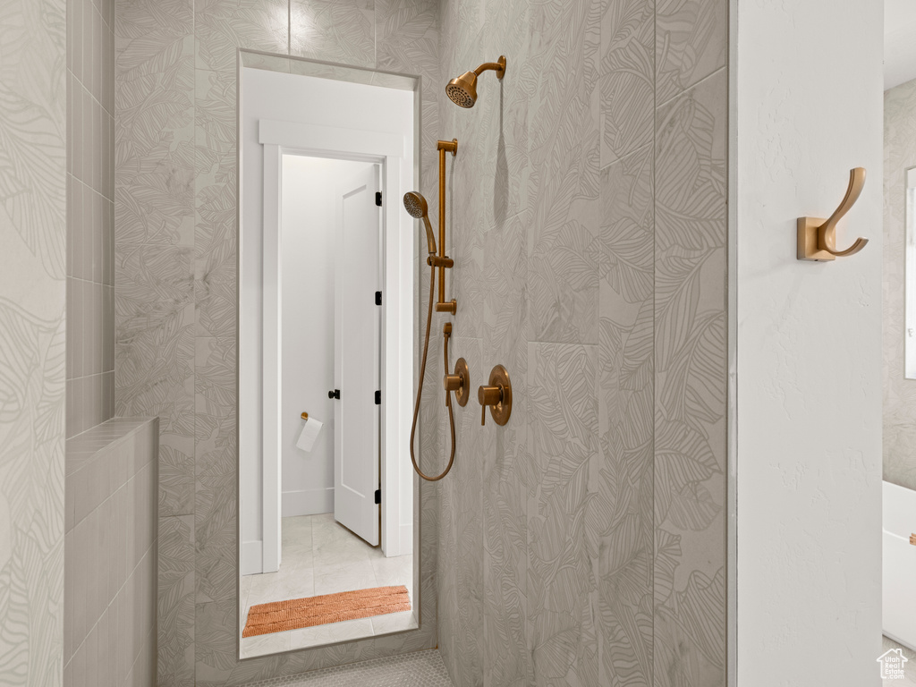 Bathroom with tile patterned flooring and walk in shower