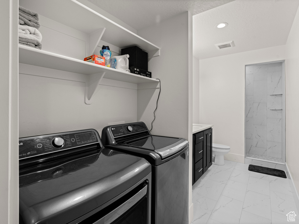 Clothes washing area with washing machine and dryer