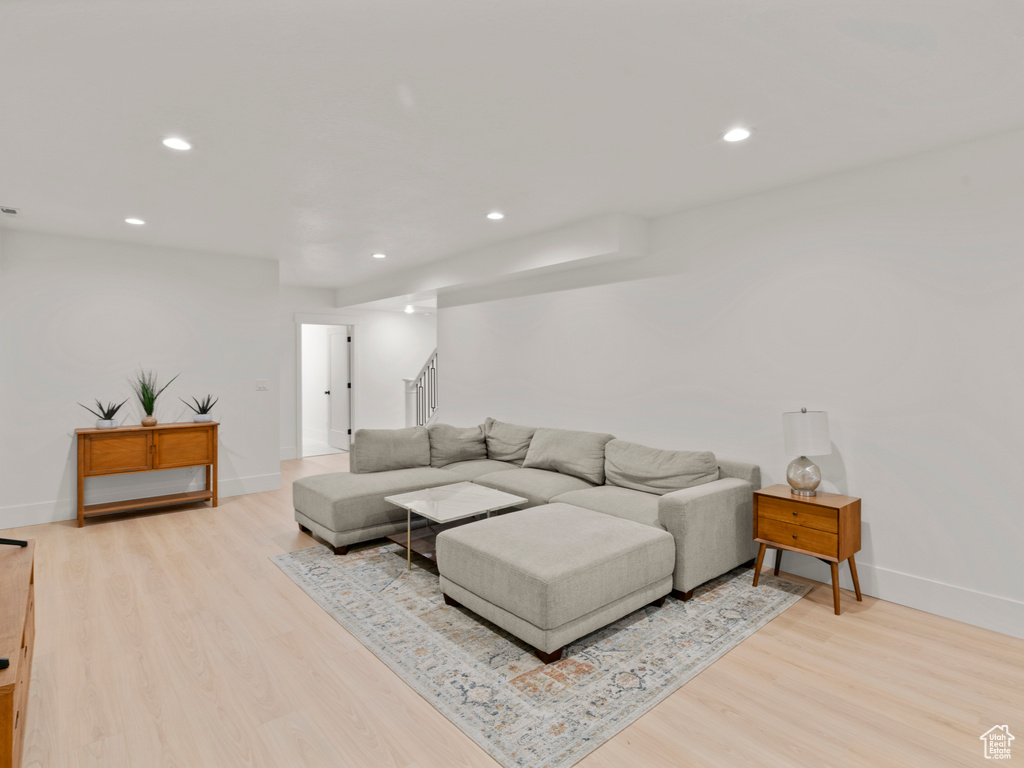 Living room with light wood-type flooring