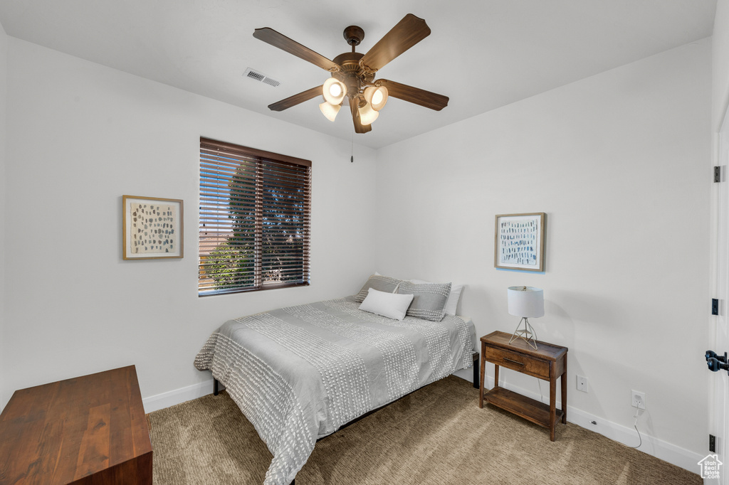 Bedroom featuring carpet and ceiling fan