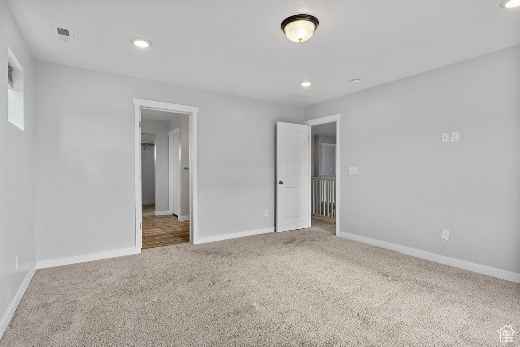 Unfurnished bedroom featuring carpet flooring