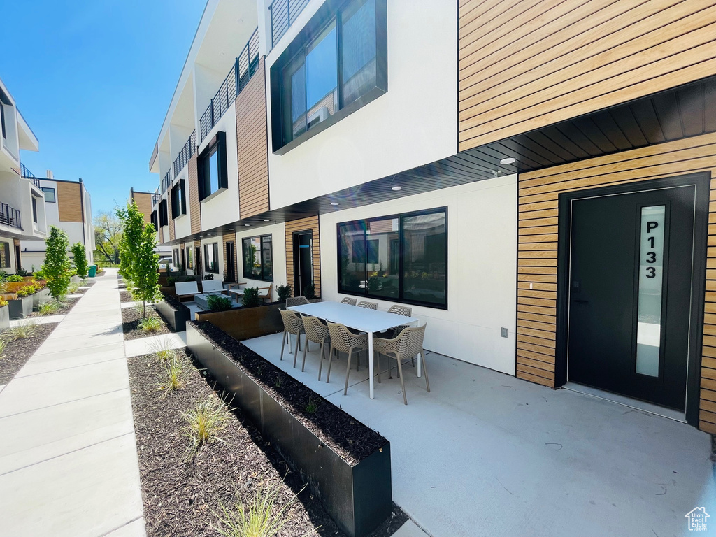 View of patio with outdoor dining area