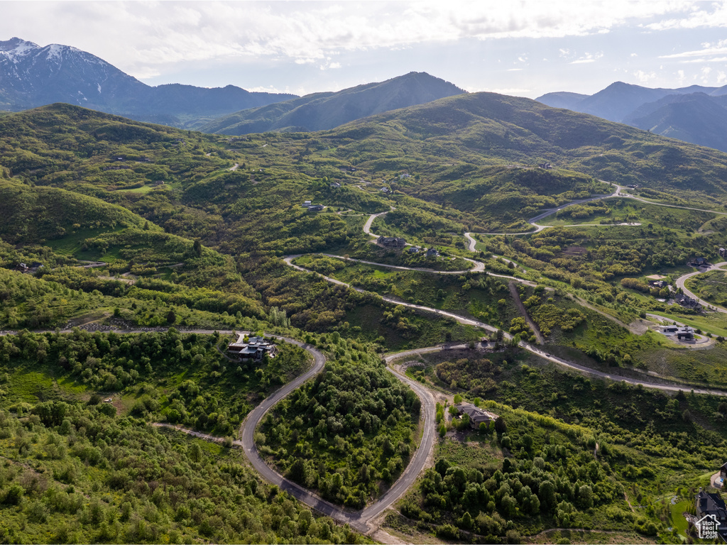 Aerial overview of property's location with a mountainous background