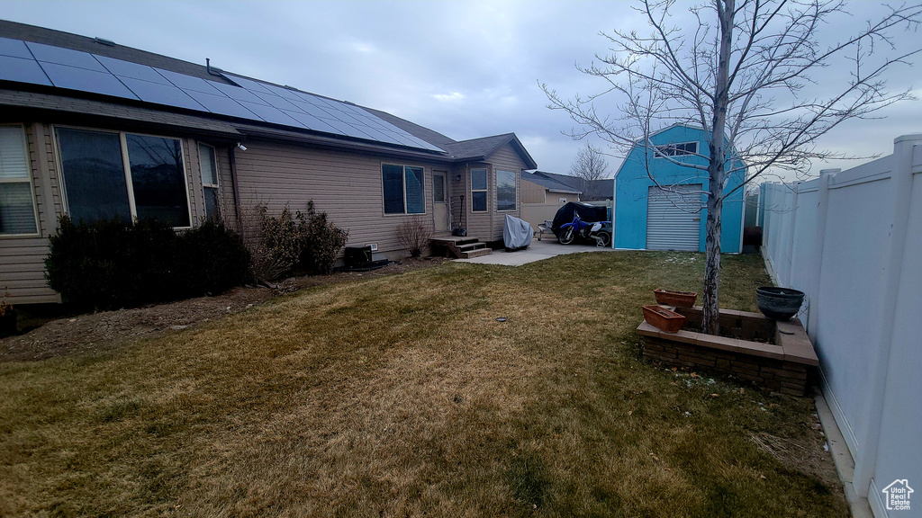 View of yard with a storage shed