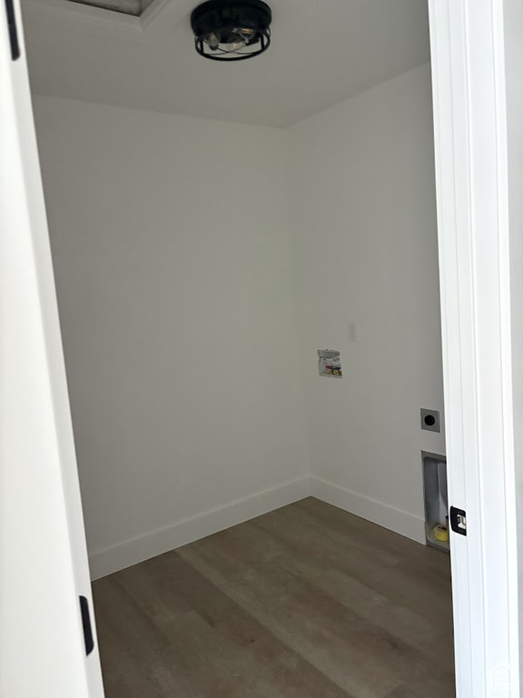 Clothes washing area featuring hookup for a washing machine and dark hardwood / wood-style flooring
