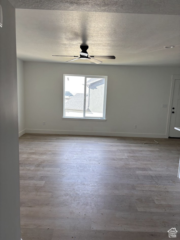 Unfurnished room featuring ceiling fan