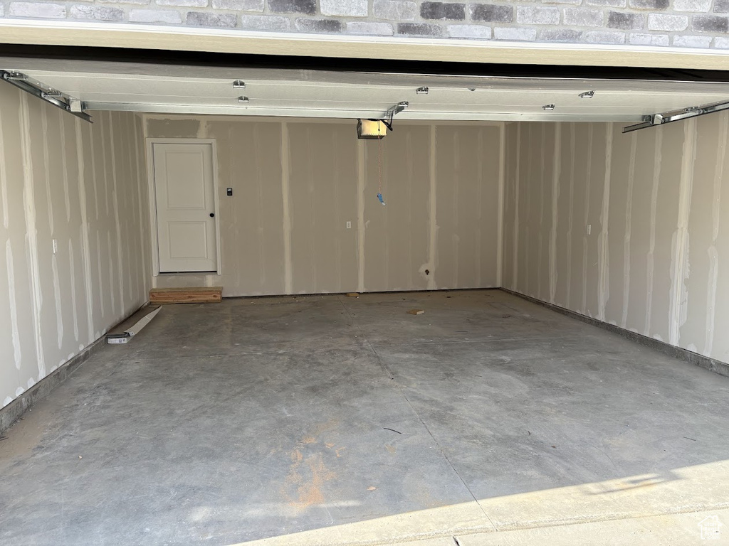 Garage featuring a garage door opener