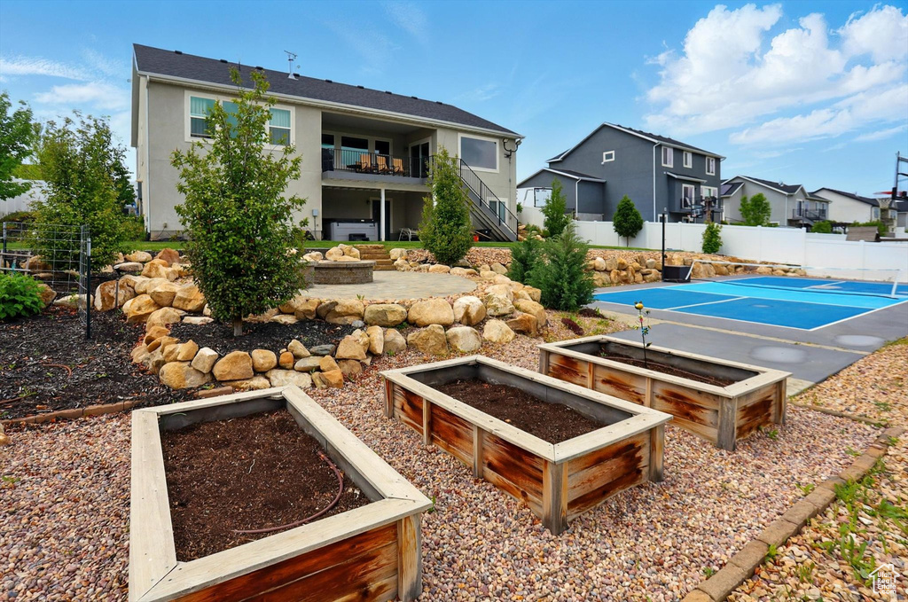 Exterior space featuring stairway, fence, and a residential view