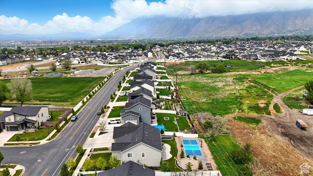 Birds eye view of property with a residential view and a mountain view