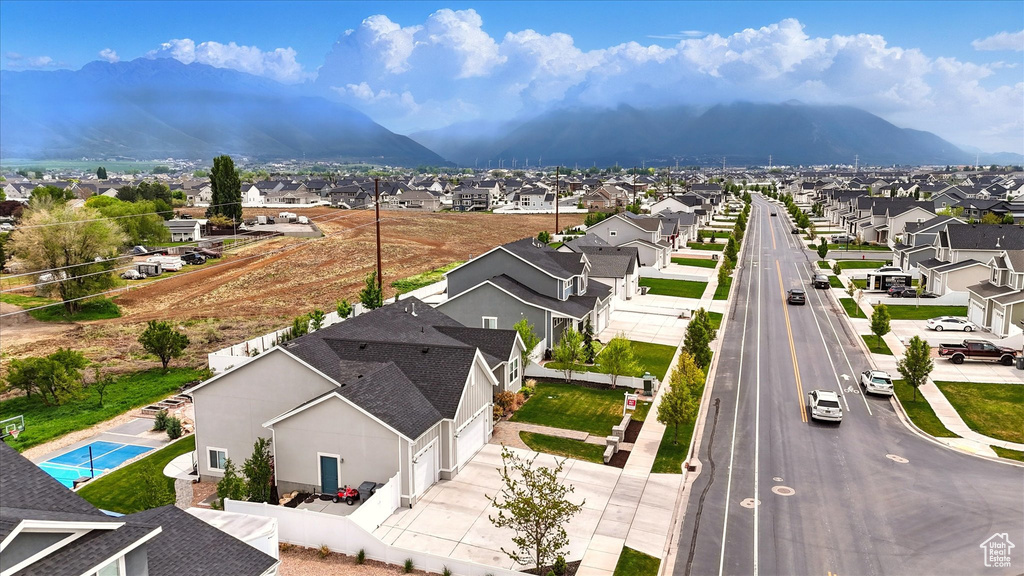 Drone / aerial view featuring a mountain view and a residential view