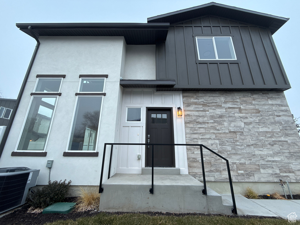 View of front of property with central AC unit