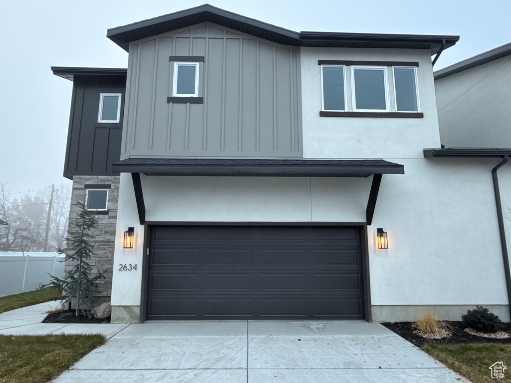 View of front of home featuring a garage