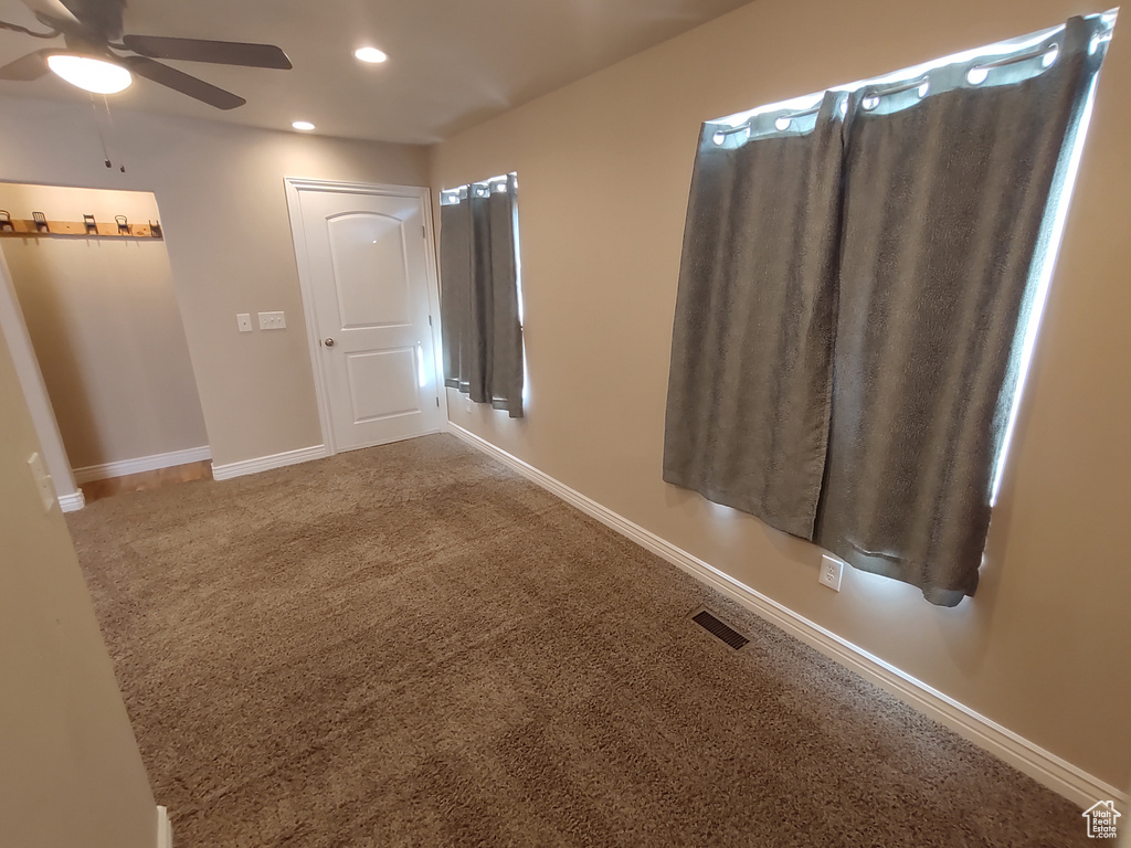 Unfurnished bedroom featuring recessed lighting, visible vents, baseboards, and carpet flooring