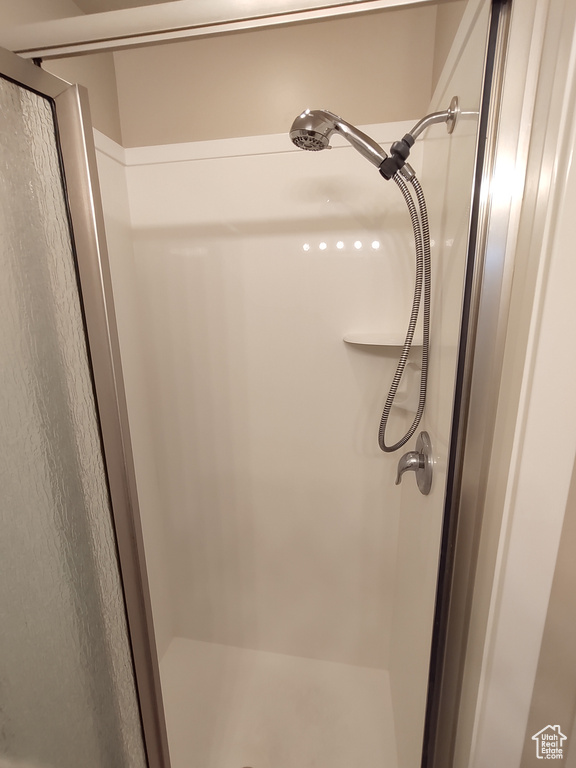 Full bath with a shower stall