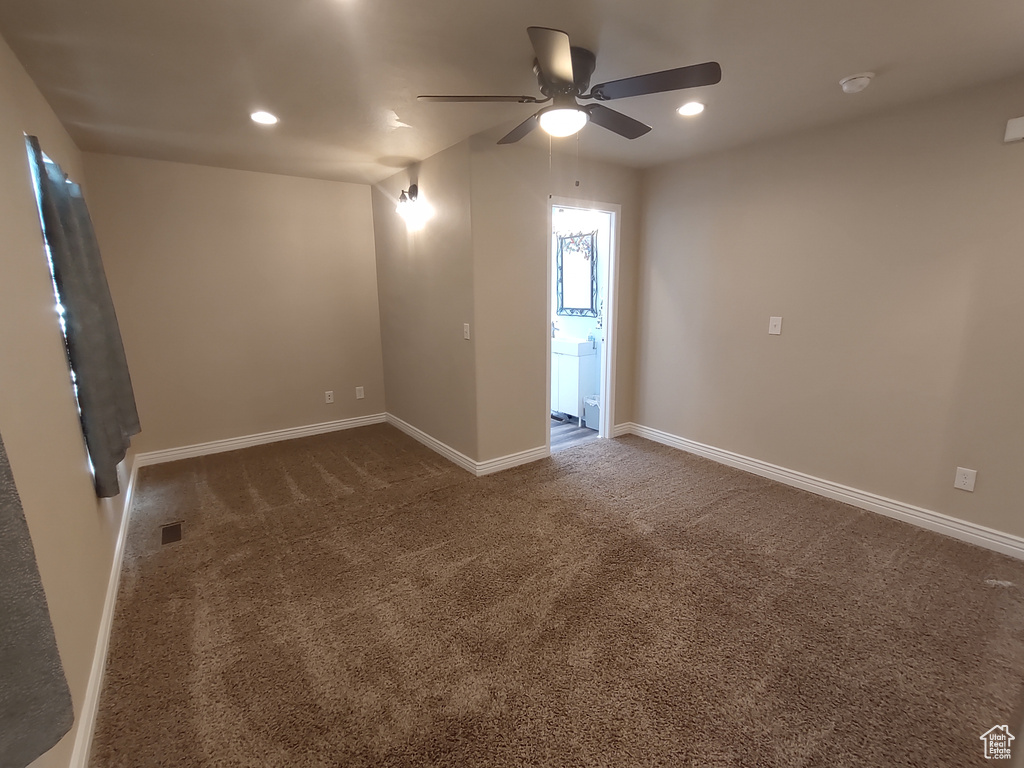 Carpeted spare room with recessed lighting, visible vents, baseboards, and a ceiling fan