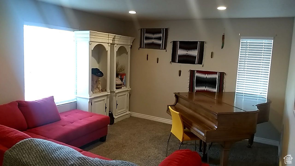 Interior space featuring carpet, recessed lighting, and baseboards