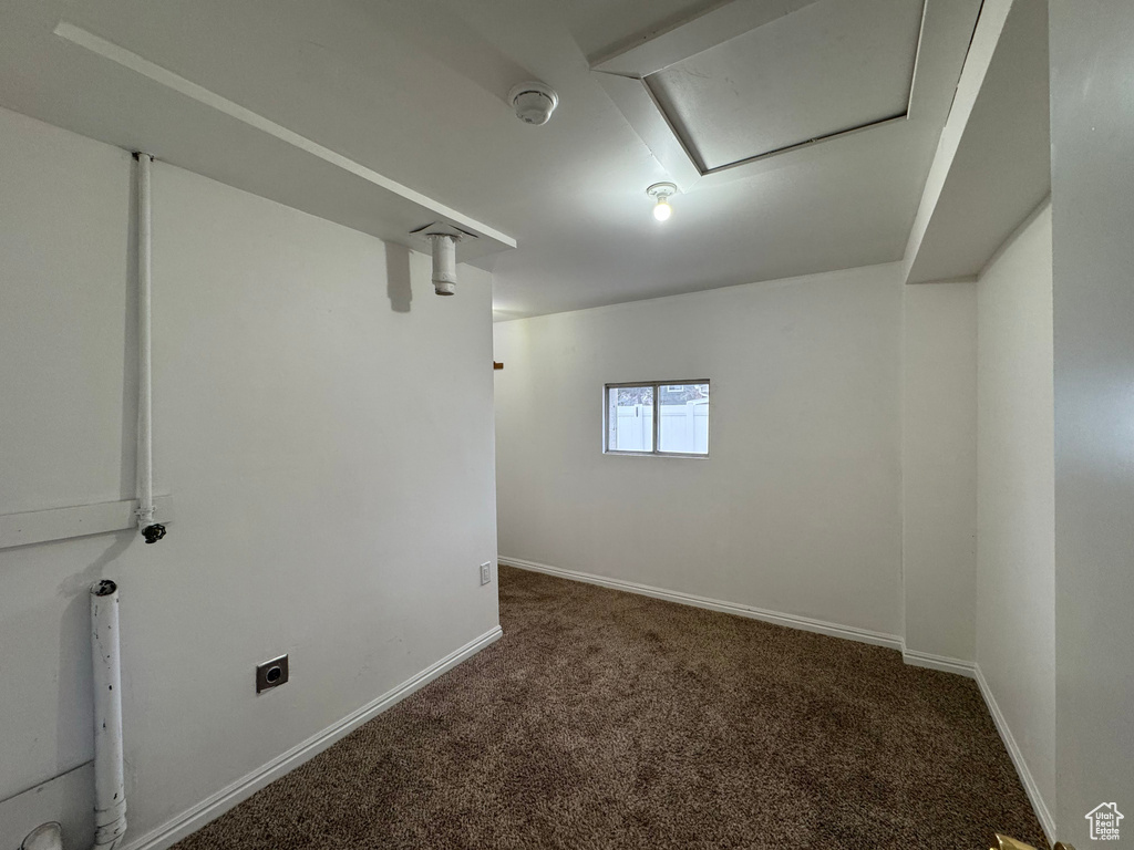Basement with dark carpet