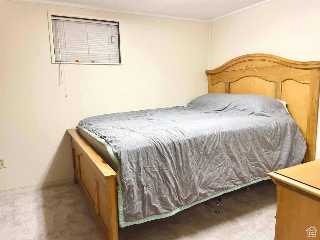 Bedroom featuring dark carpet