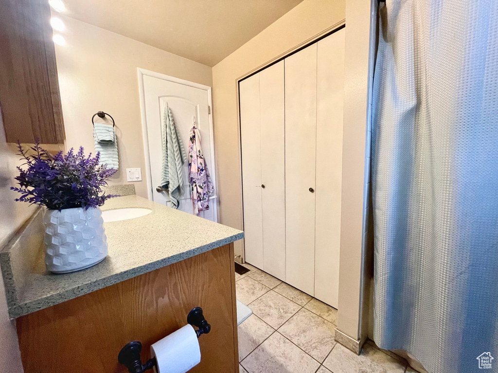 Bathroom with vanity and tile patterned floors