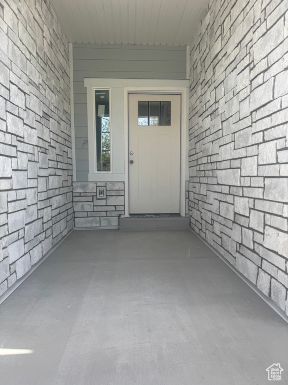 View of exterior entry with stone siding