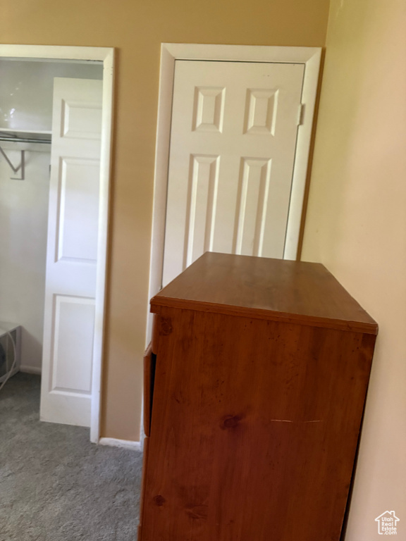 Detailed view of carpet floors and baseboards
