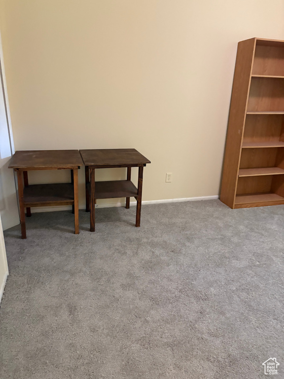 Empty room with carpet flooring and baseboards