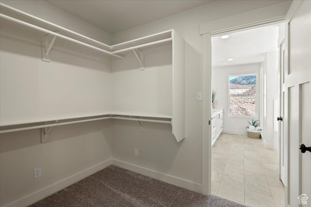 Walk in closet featuring light tile patterned floors