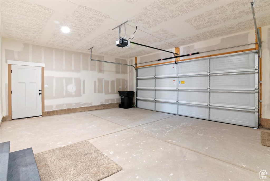 Garage featuring a garage door opener