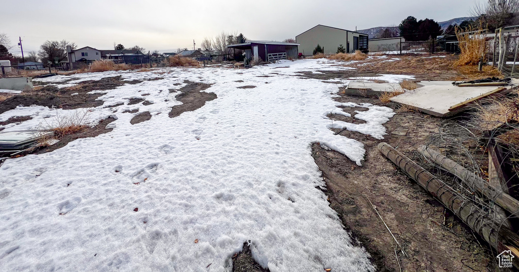 View of yard covered in snow