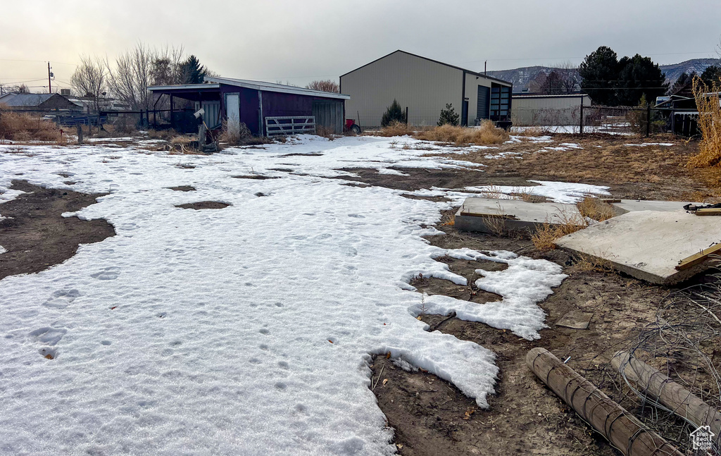 View of yard layered in snow