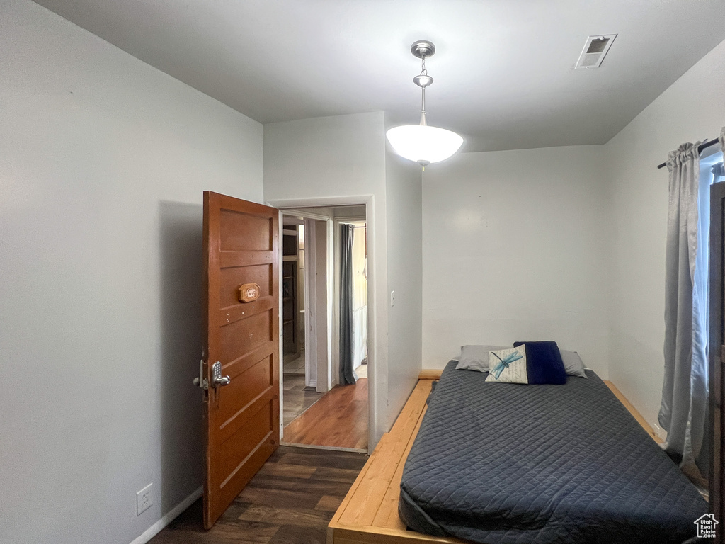 Bedroom featuring dark hardwood / wood-style flooring